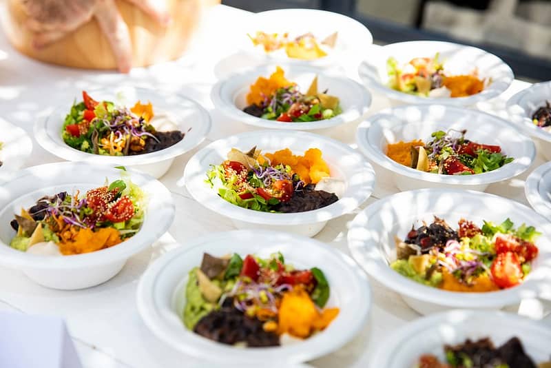 Array of vegan and vegetarian mexican salad bowls made out for a private corporate event. The food is healthy, holistic, organic, natural, tasty and fresh. The perfect choice for an elegant buffet