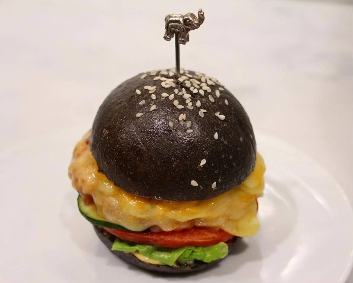 Surprising approach to a traditional burger, this time is made out of a black bun topped with white sesame seeds, and instead of meat, this pescaetarian alternative is made out of premium wild Sockeye salmon